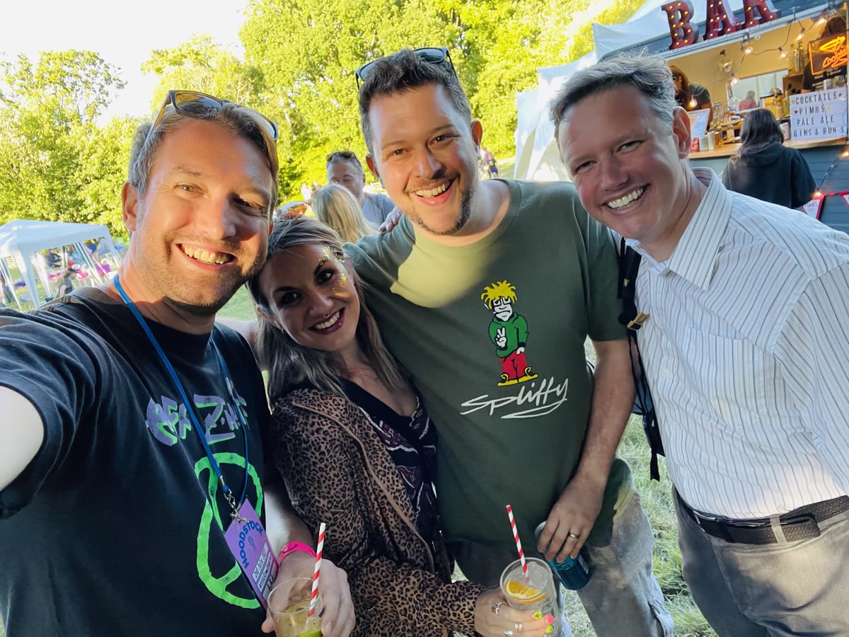 A group of friends posing together at Hoodstock